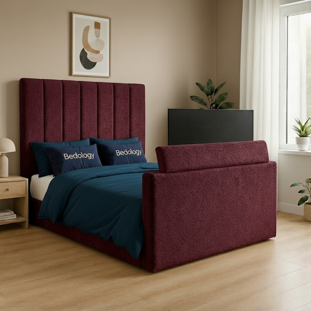 Maroon upholstered bed with green bedding in a bedroom setting